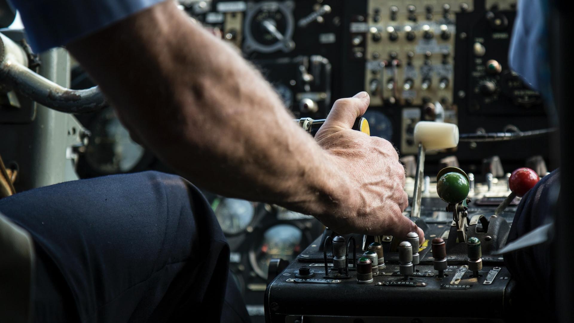 person operating black audio mixer